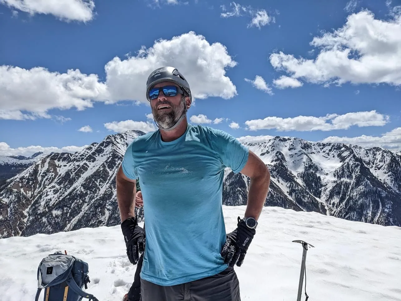 Jason on a snowy mountain summit